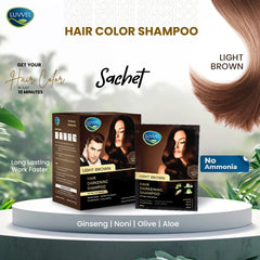 Luvvel hair color shampoo sachets for light brown hair on a white platform with greenery.
